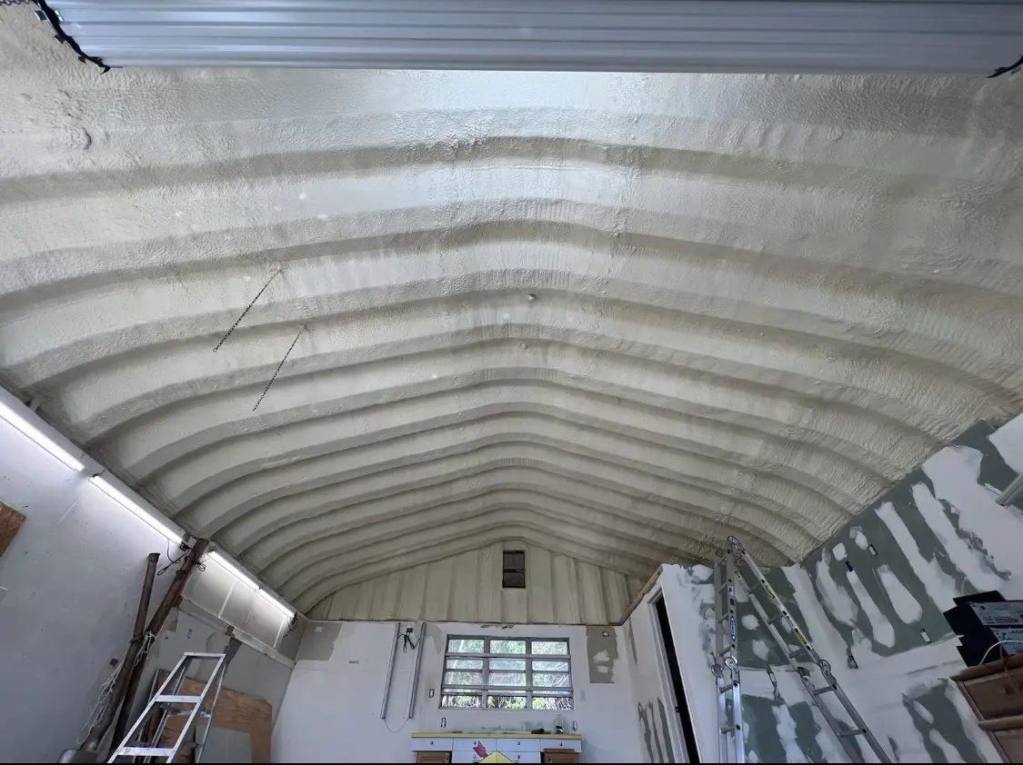 Spray polyurethane foam applied to the underside of a metal roof deck in Moorhead